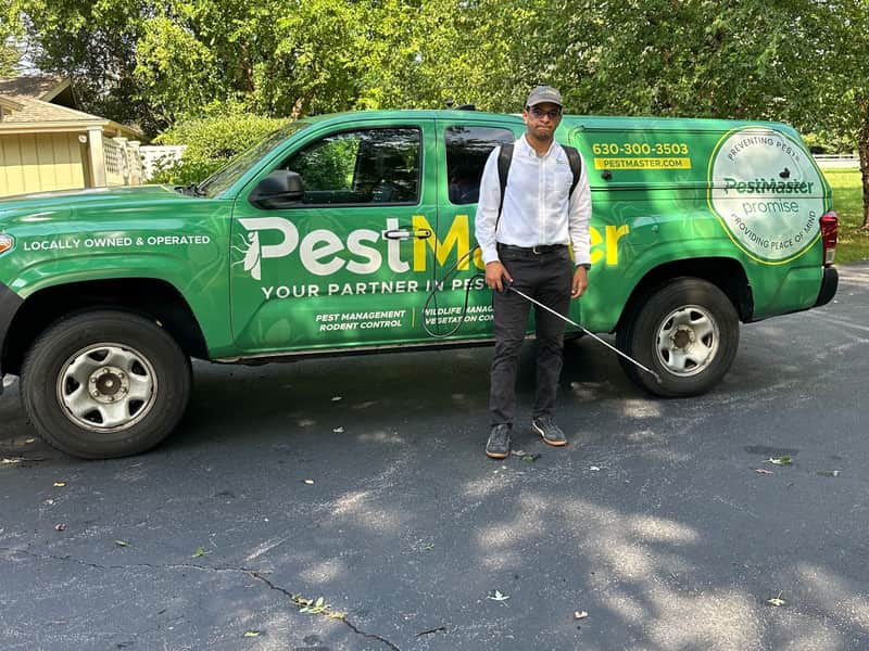 PestMaster of Naperville/Wheaton technician with the company truck